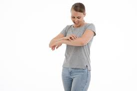 Woman Itching Arm